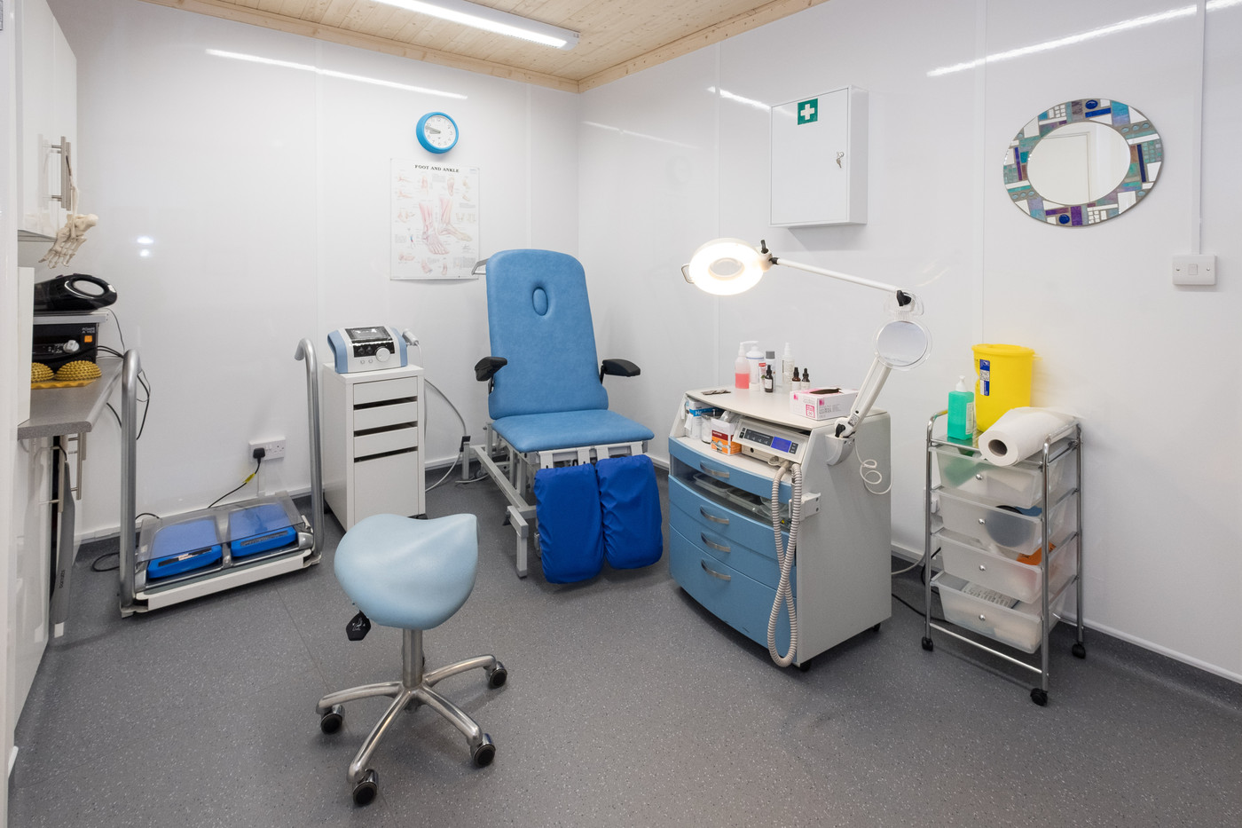 Clean and modern podiatry treatment room with professional equipment
